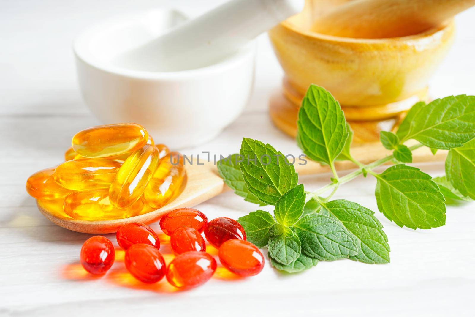 Alternative medicine herbal organic capsule with vitamin E omega 3 fish oil, mineral, drug with herbs leaf natural supplements for healthy good life.
