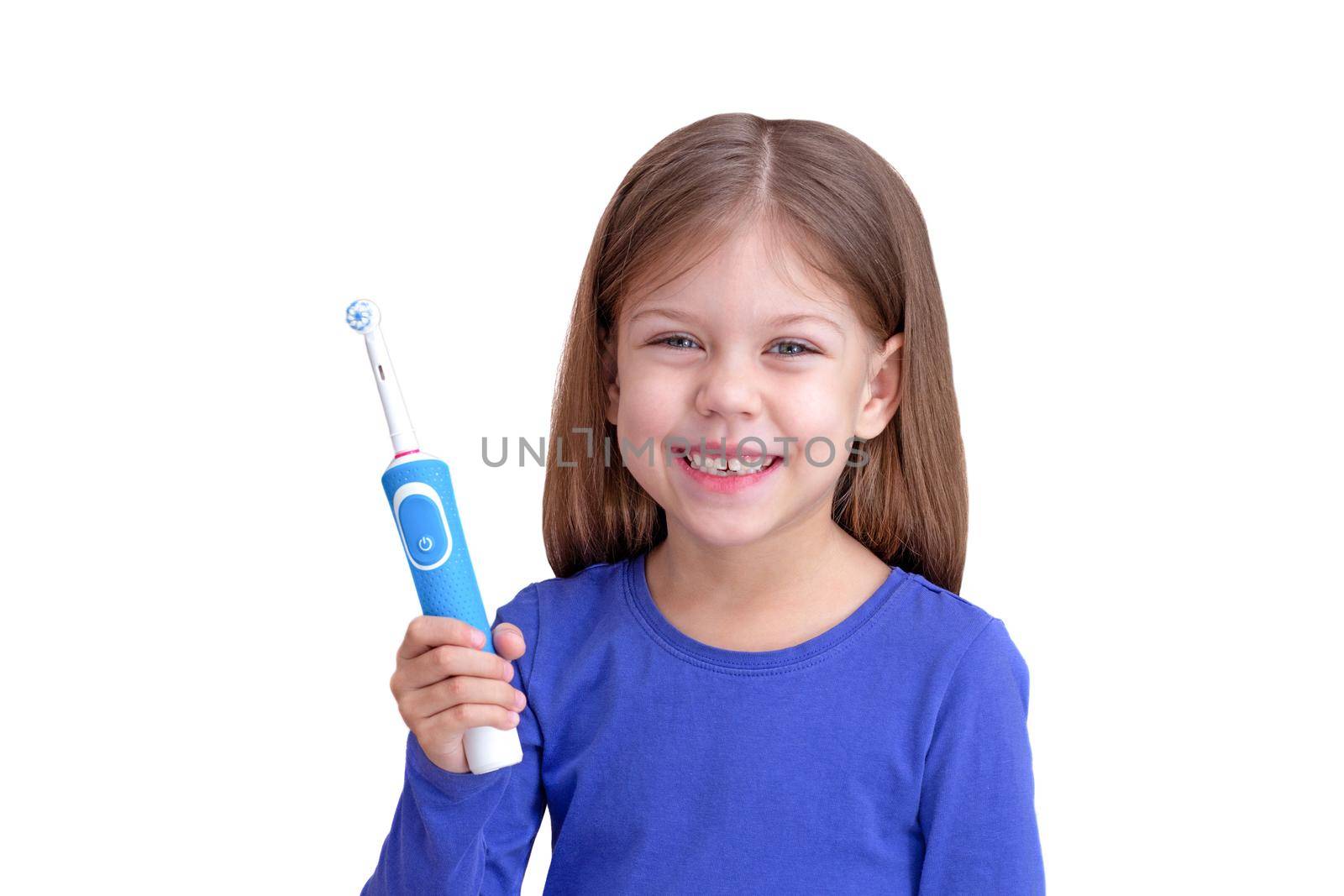 Smiling child holding electric toothbrush by TatianaFoxy