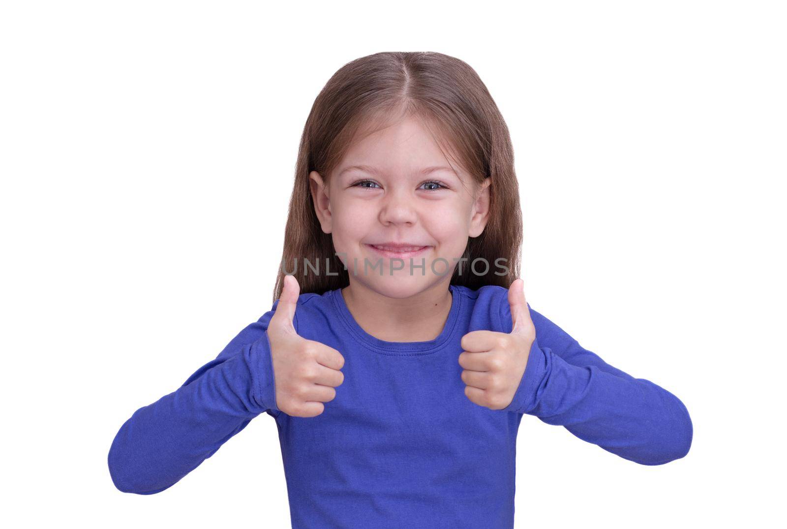 Happy and smiling child kid with thumbs up on two hands, isolated on white background looking at camera waist up caucasian little girl of 5 years in blue