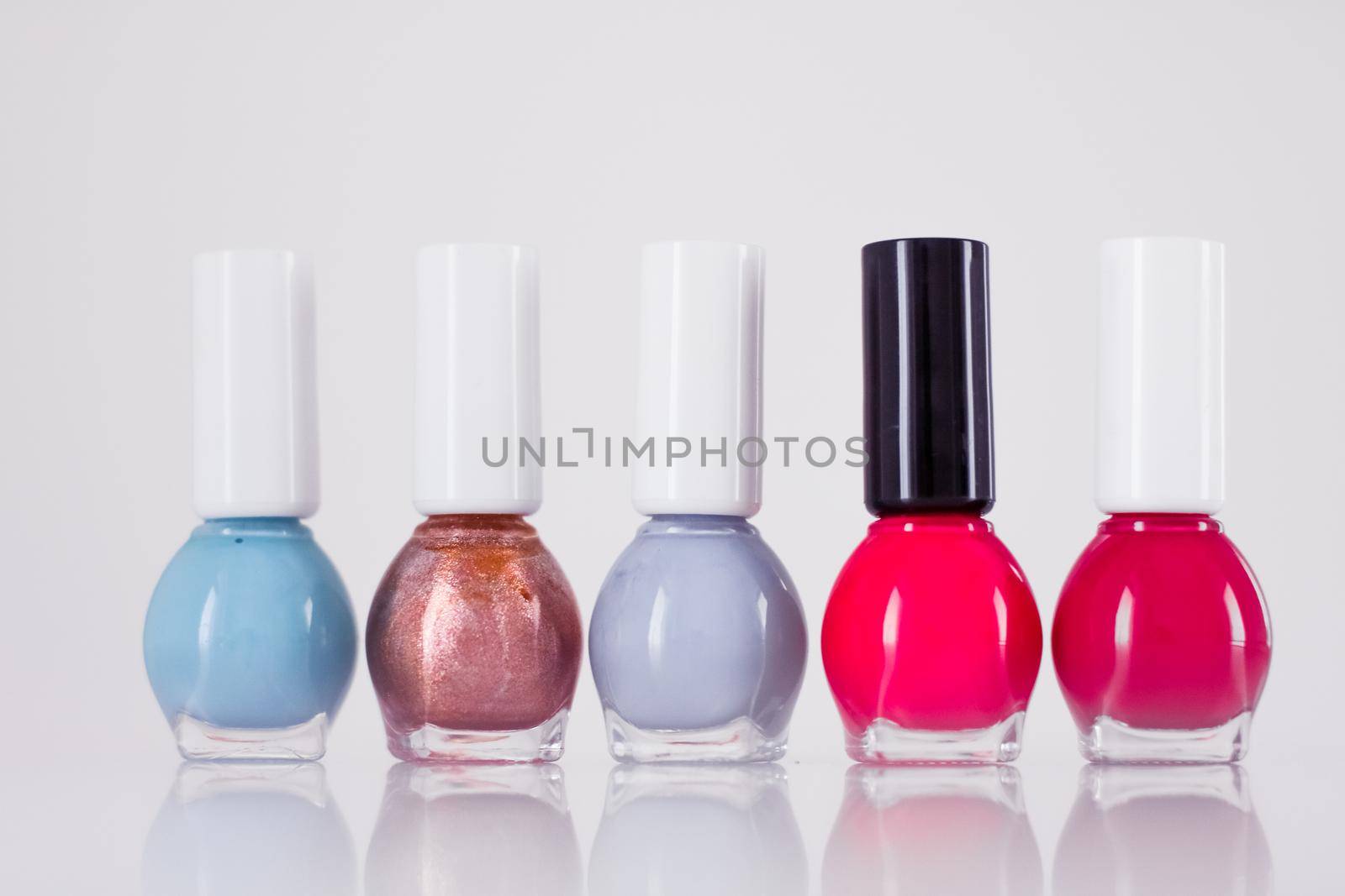 Beauty, make-up and cosmetics concept - Nail polish bottles, manicure and pedicure collection