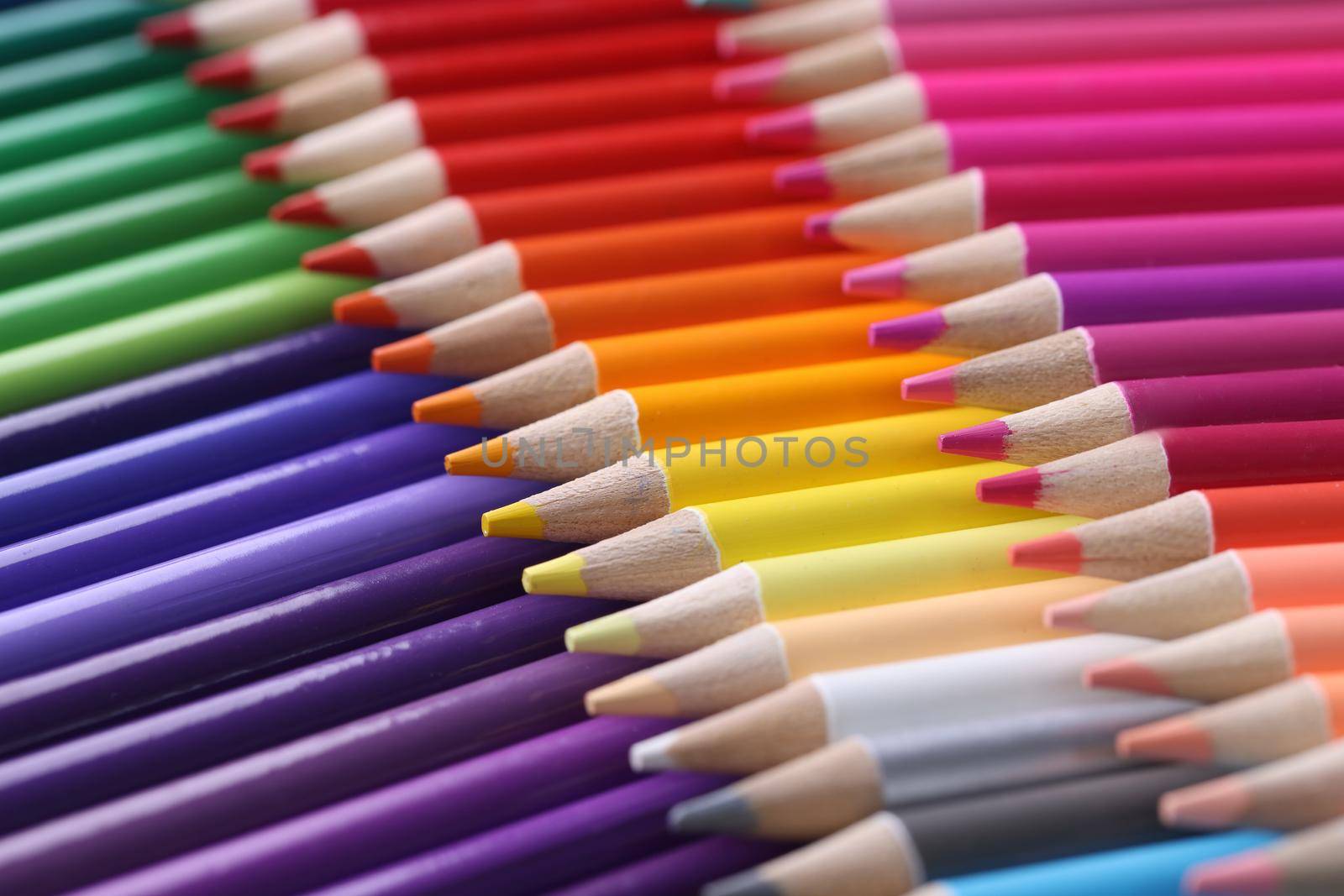Colored pencils closeup. Collection of colored pencils in row concept