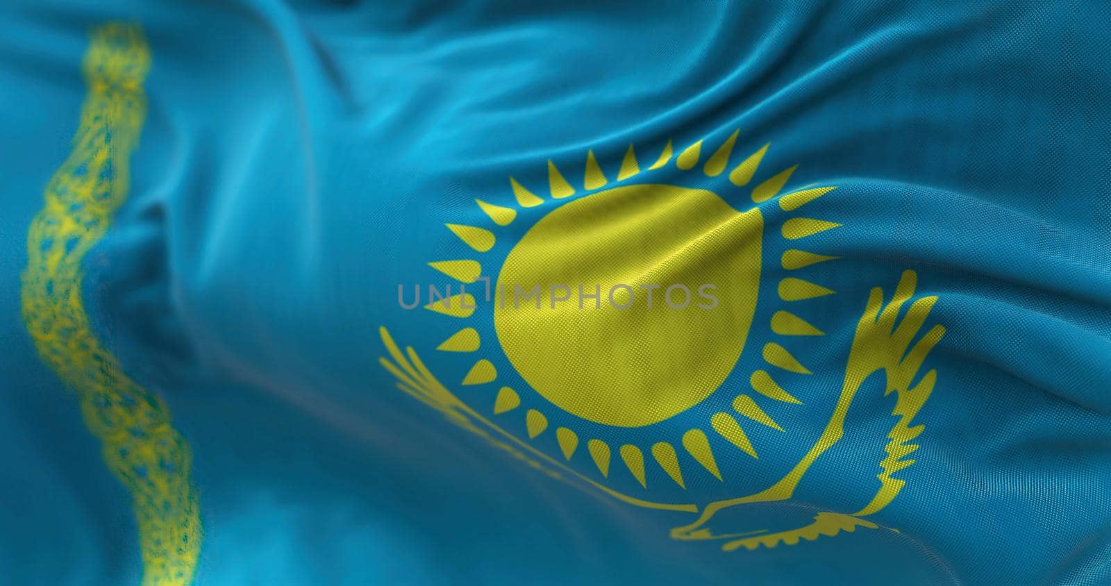 Close-up view of the Kazakhstan national flag waving in the wind by rarrarorro