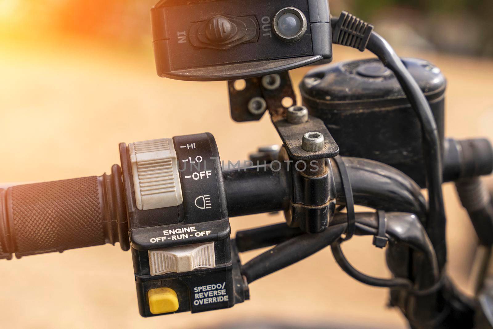 atv controls close-up. switches on the handlebar of the ATV. rubber grips