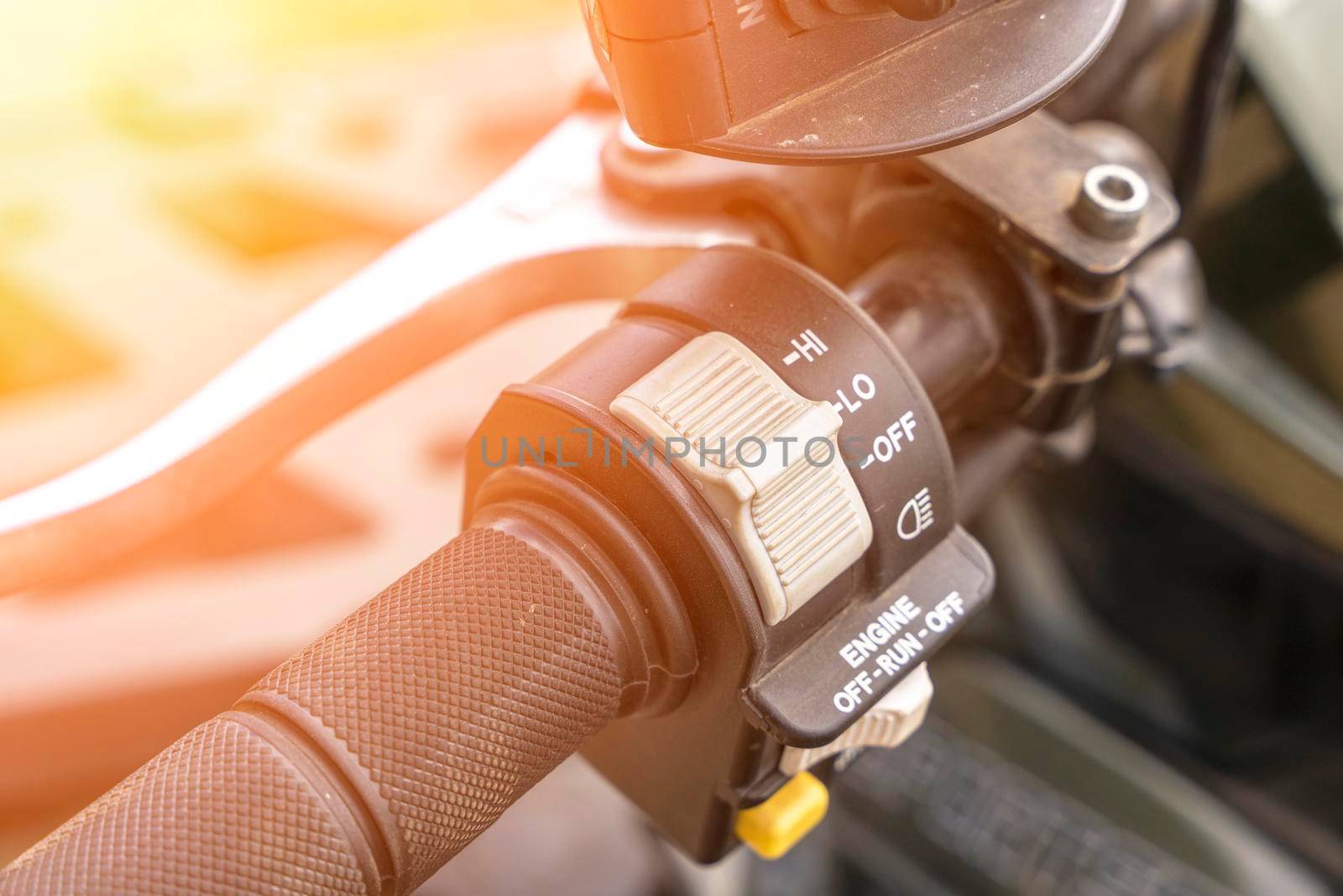 atv controls close-up. switches on the handlebar of the ATV. rubber grips