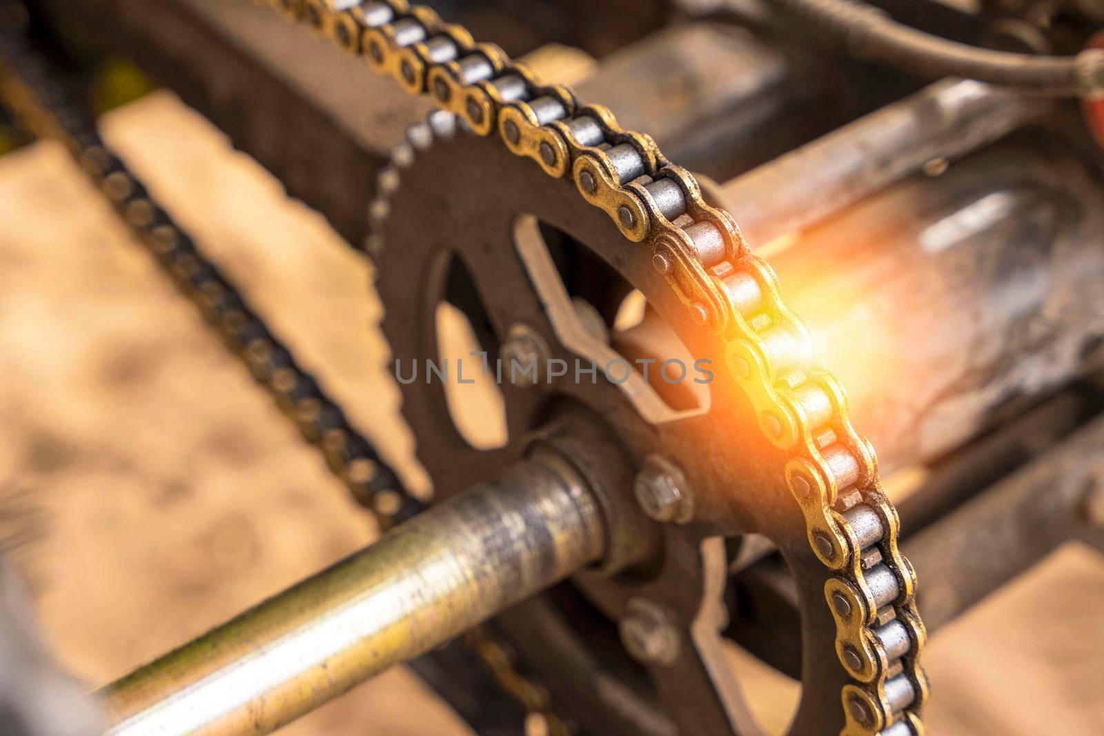 chain drive of the rear axle of the ATV close-up. rear suspension, atv brakes. Industrial roller chain, technology