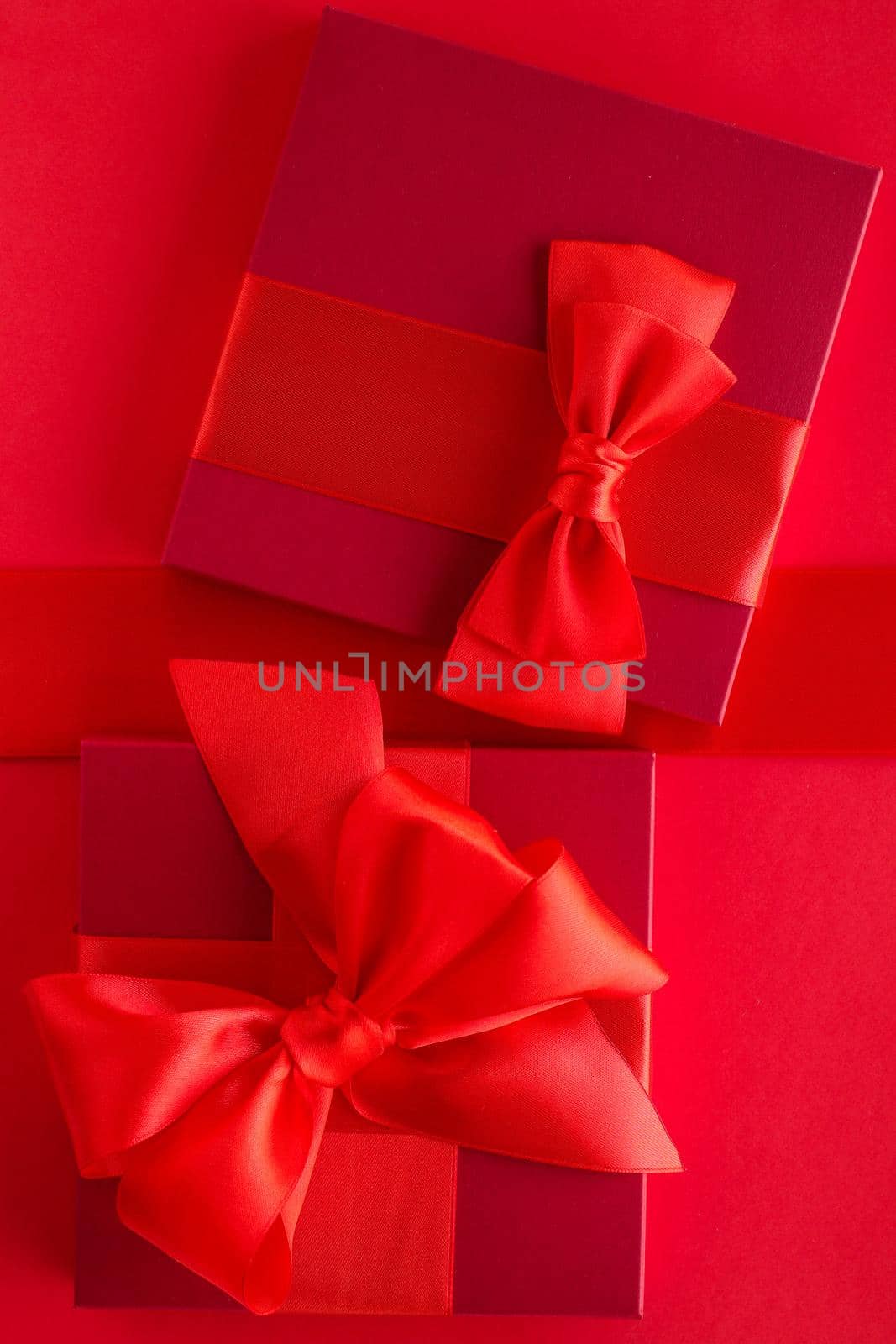 Luxury holiday gifts on red by Anneleven