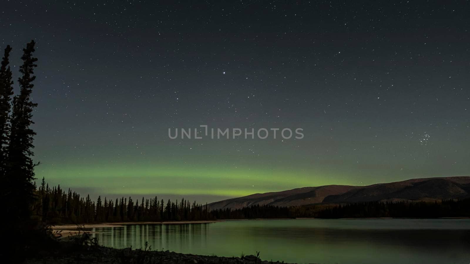 Northern Light Display and the Pleiades over Lake Boya