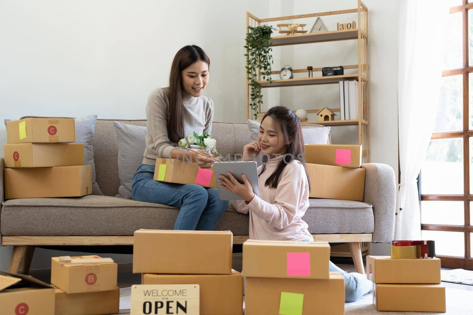 Start up small business. freelance women sellers check product order to prepare for delivery to customers. Online selling, e-commerce, shipping.