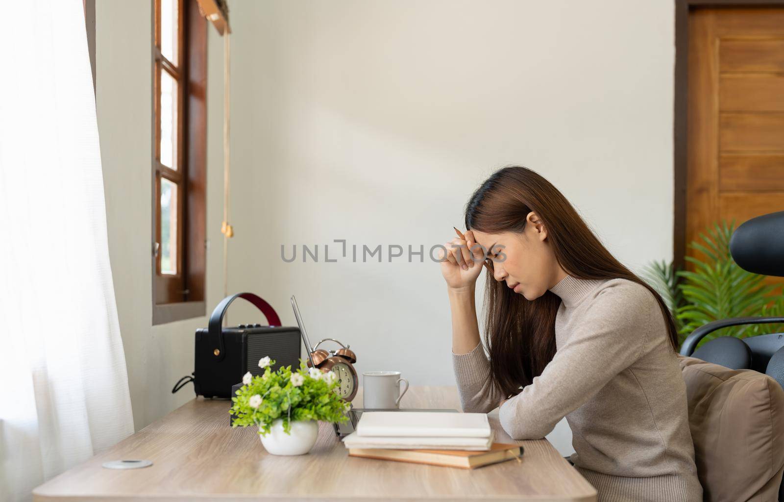 Young asian Woman Feels Sudden Burst of Pain, Headache, Migraine. Overworked Accountant Feeling Project Pressure, Stress, Massages Her Head, Temples