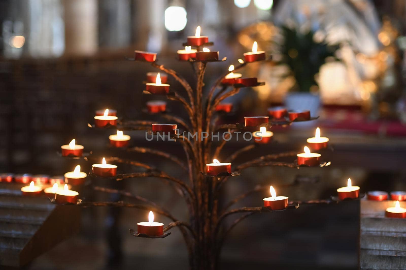 Many candles in the dark church