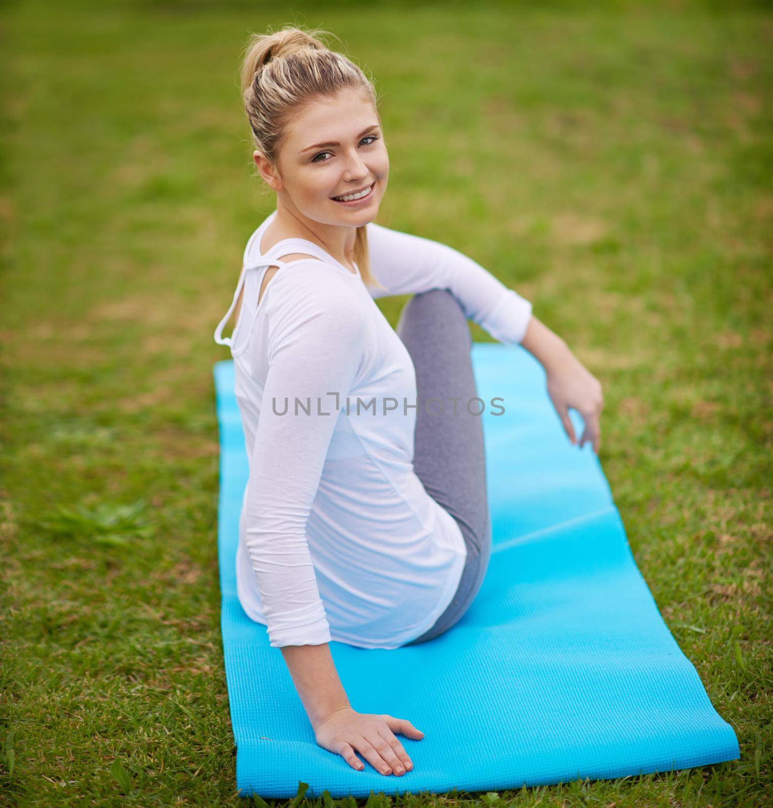 Yoga is part of my daily routine. a young woman doing yoga in the outdoors