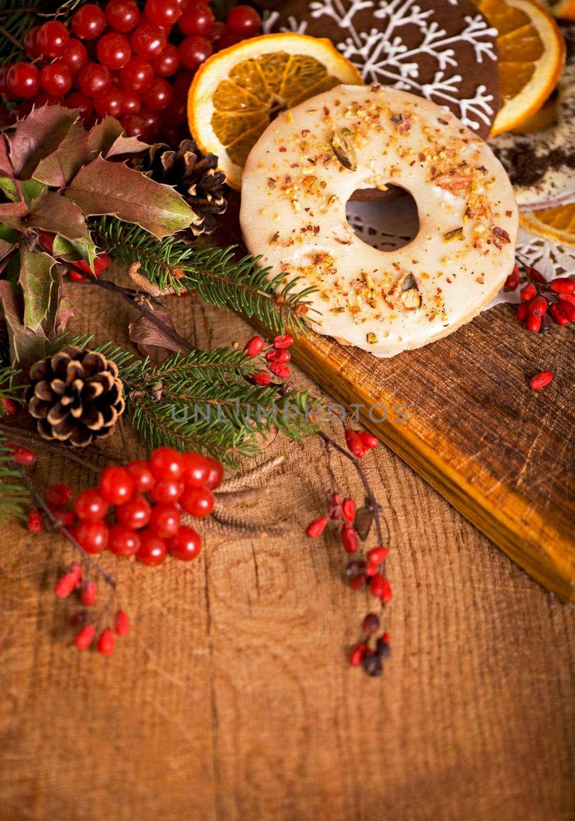 Christmas - baking cake background. Dough ingredients and decorations on vintage planked wood table from above. Rural kitchen layout with free text space.