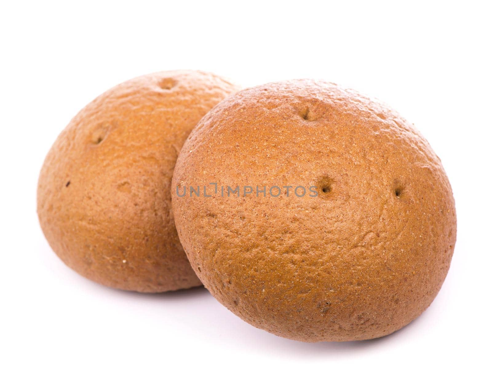 Homemade bread with raisins lie on a white background