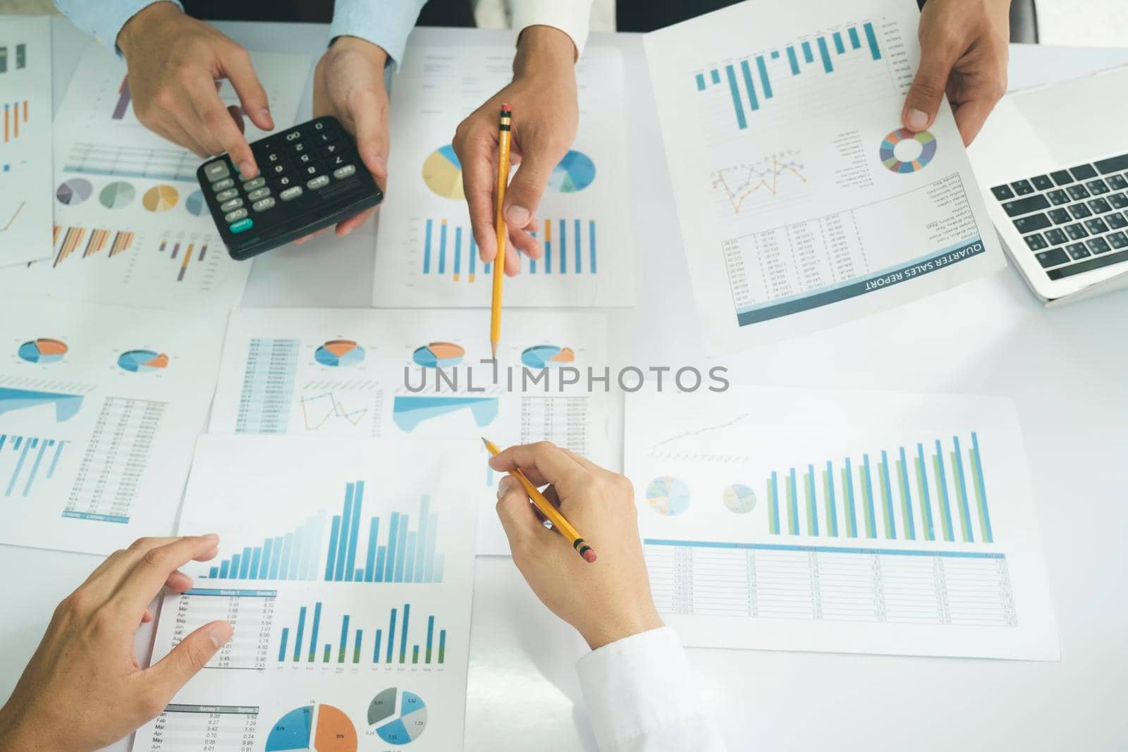 Startup asian business teamwork analyse investment marketing data on computer laptop and use calculator , finance meeting.