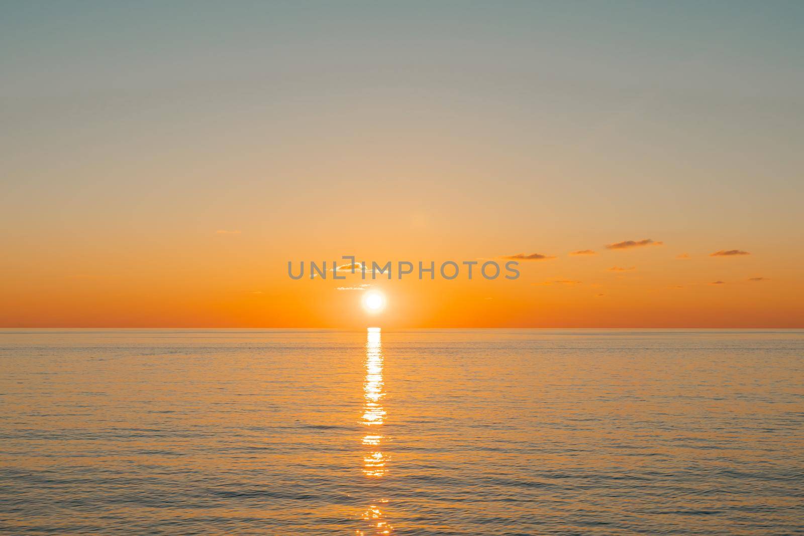 Evening sunset over the sea. Beautiful seascape from the shore.
