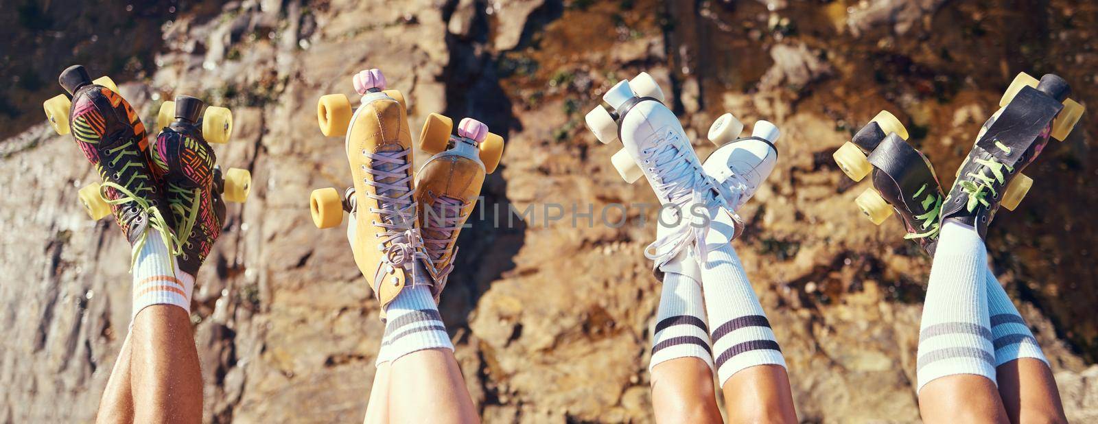Roller skates, fun and adventure travel with friends group lifting legs and showing off retro skating footwear while outside. Group of women enjoying hobby, freedom and activity on holiday together by YuriArcurs
