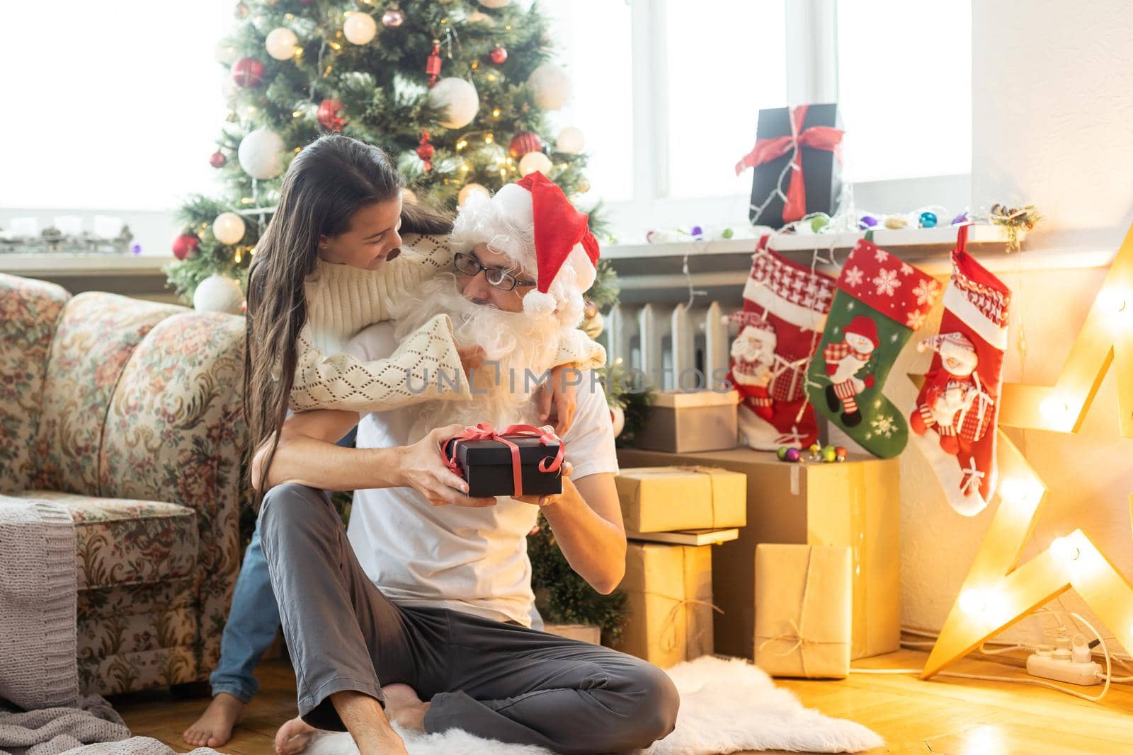Santa Claus and child. Christmas holiday concept.