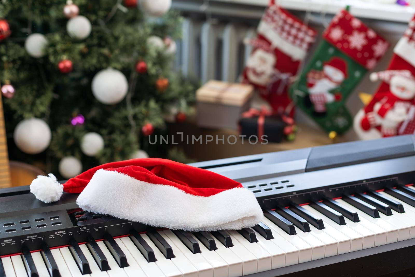 New Year's composition on a musical synthesizer. lights of a garland. Merry Christmas greeting card. Happy New Year.