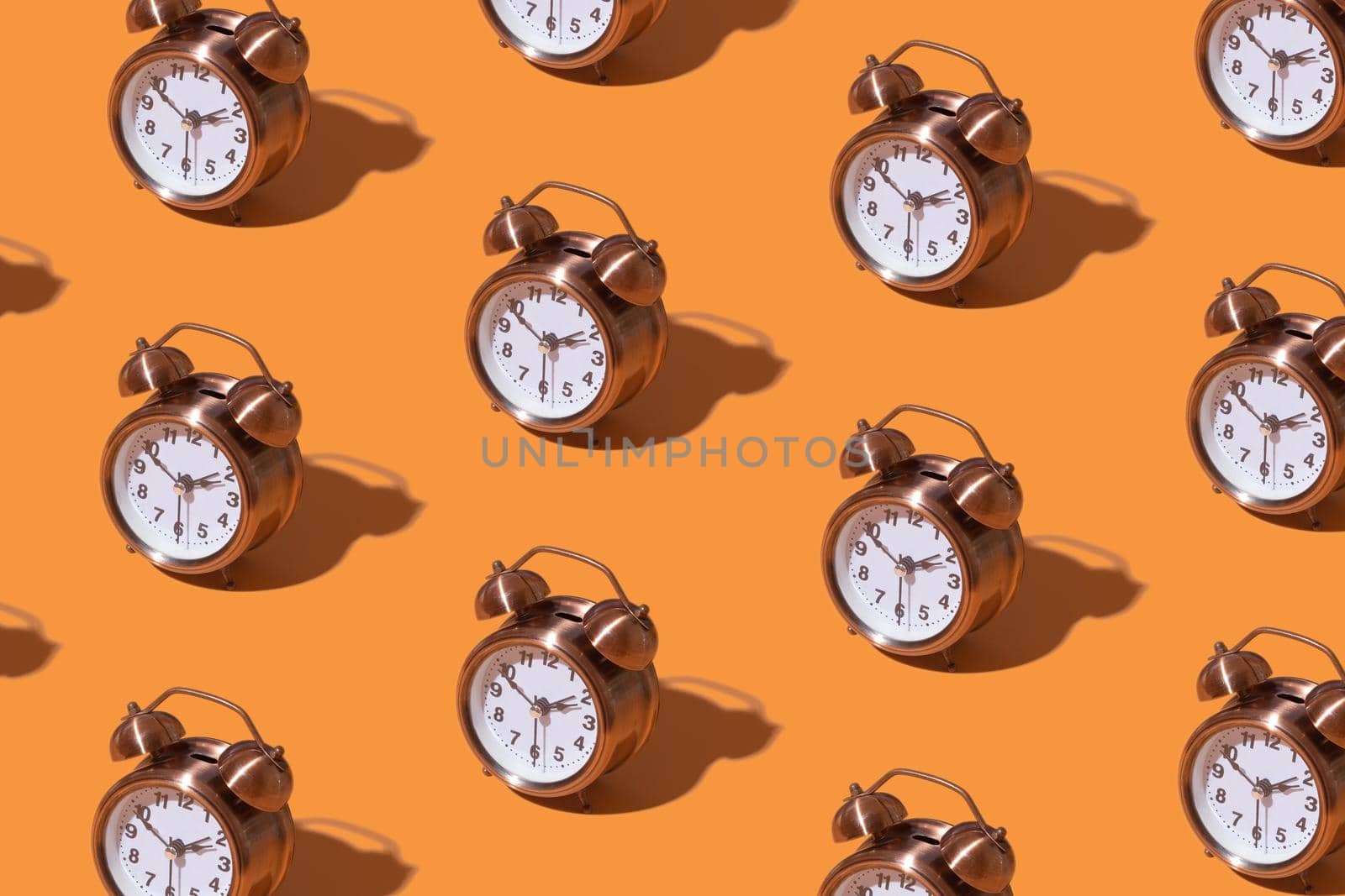 Pattern of an alarm clock on a colored background. Monochrome time concept by ssvimaliss