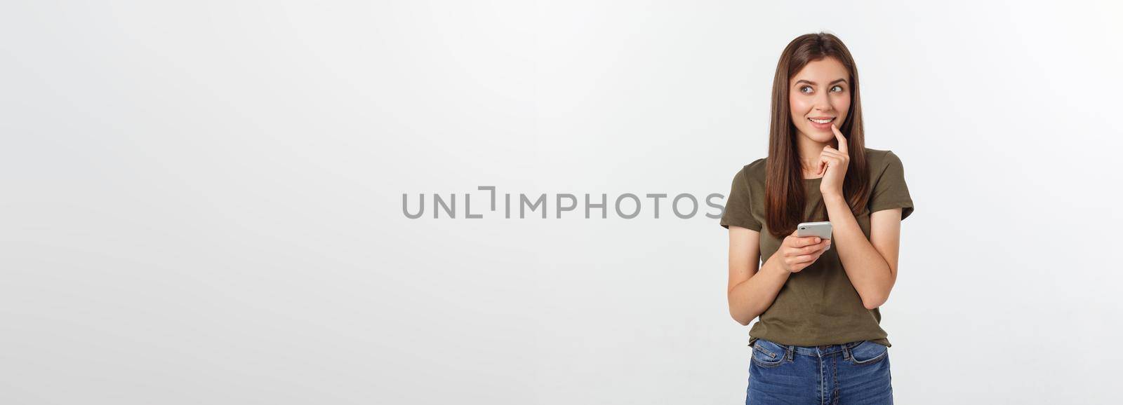 Laughing woman talking and texting on the phone isolated on a white background