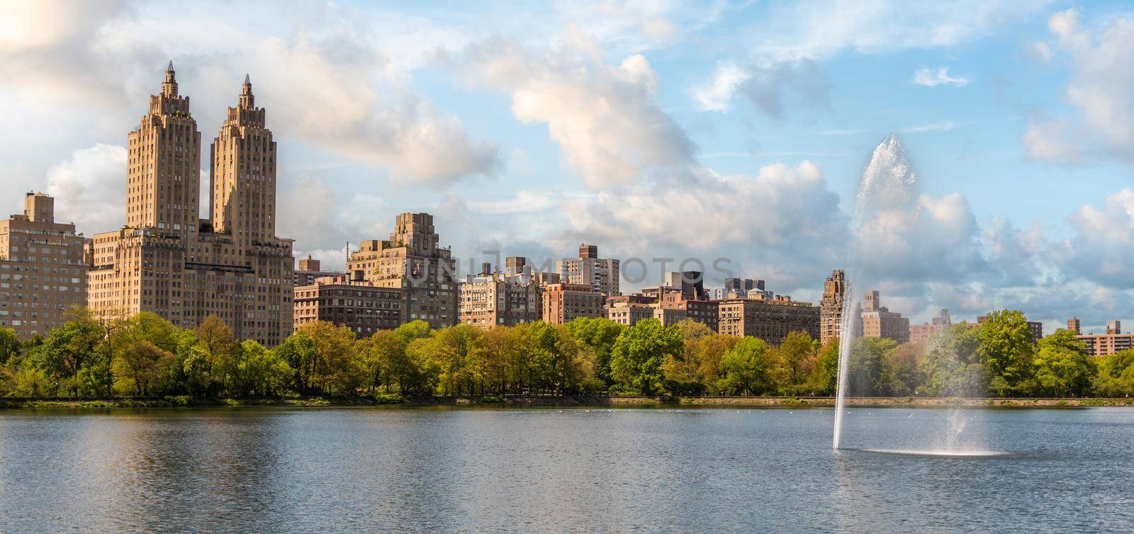 Skyline panorama with Eldorado building and reservoir with fountain in Central Park in midtown Manhattan in New York City by Mariakray