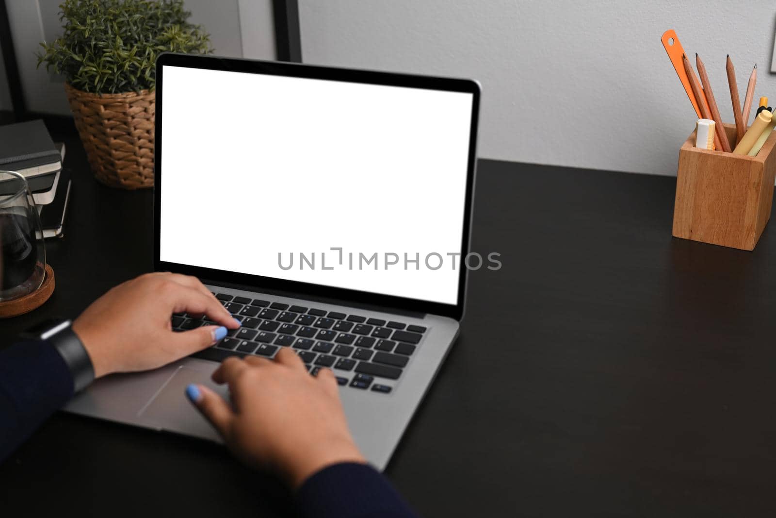 Female freelancer working on project with computer laptop. by prathanchorruangsak
