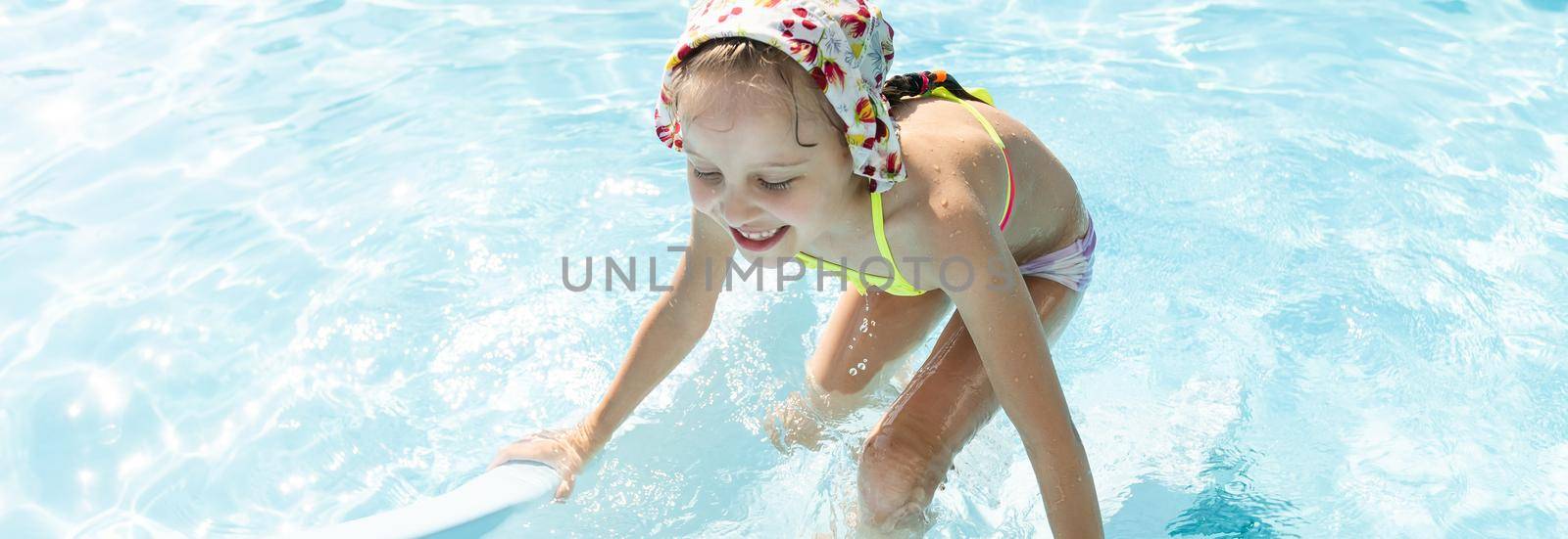 Swimming - little girl playing in blue water by Andelov13