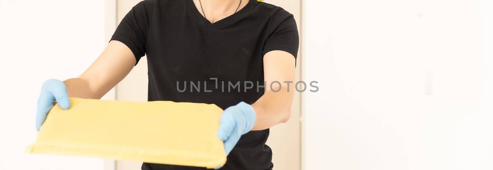 delivery man in protective gloves and a mask.