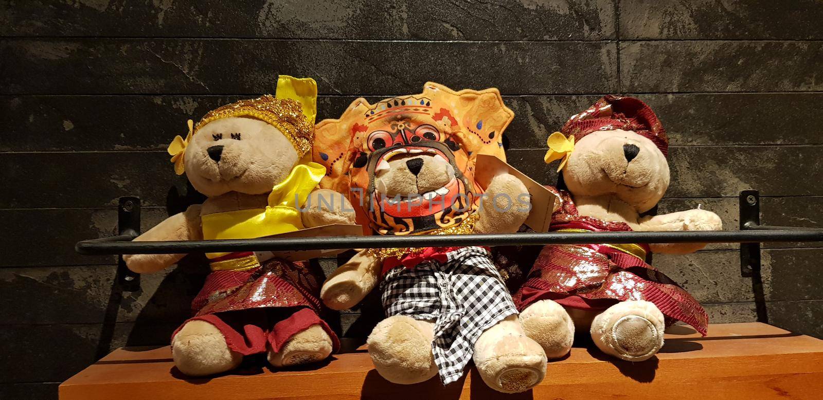 Group of Fluffy Stuffed Bear Toys Wearing various Clothes, teddy bear stuffed animal sitting in the wood bracket