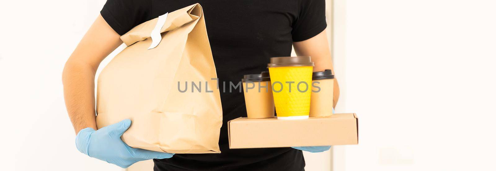 delivery man in protective gloves and a mask.