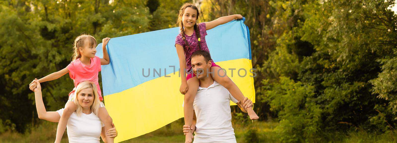 happy family with flag of ukraine in field. lifestyle.