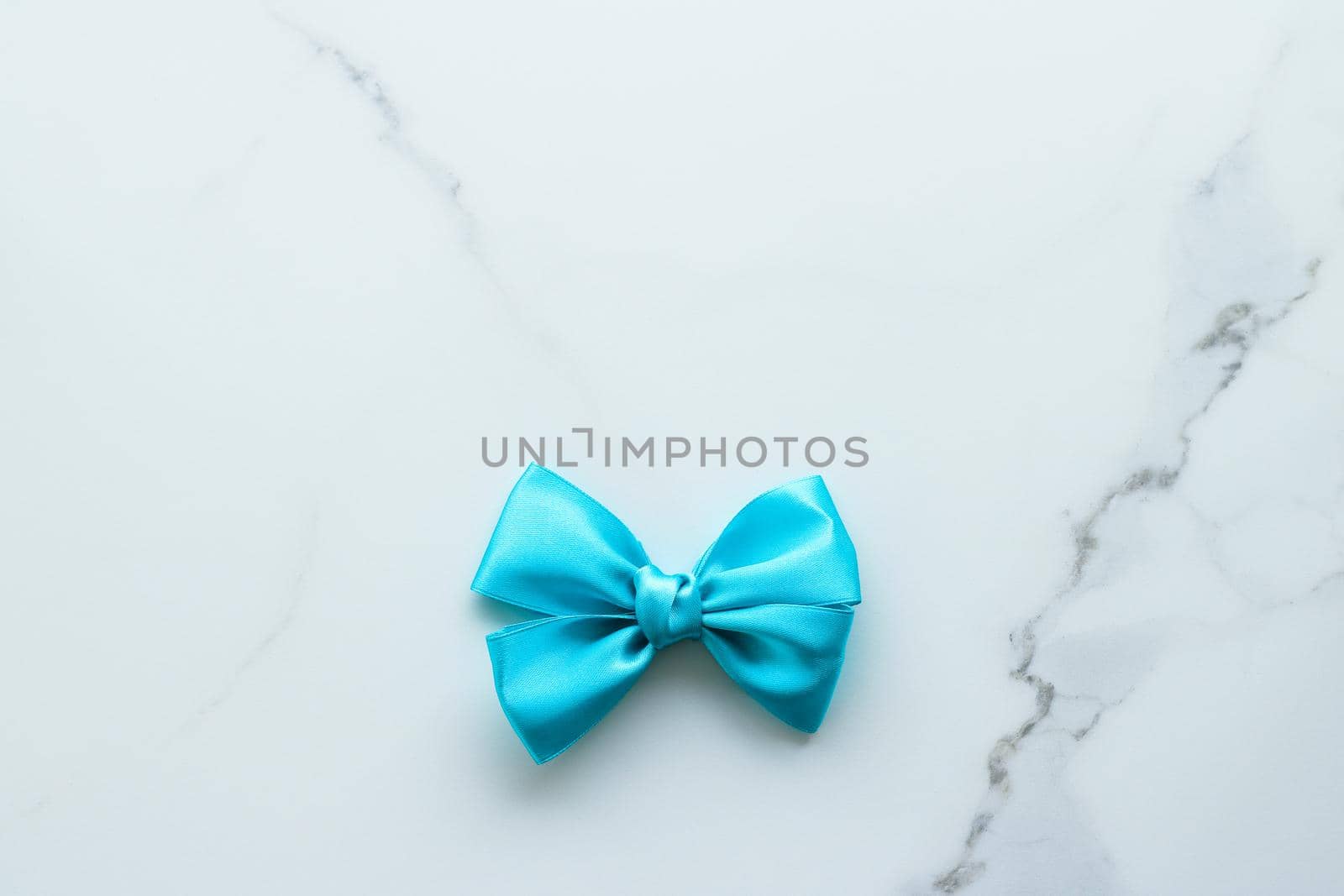 Holiday decor, feminine design and flatlay concept - Blue silk ribbon on marble, top view