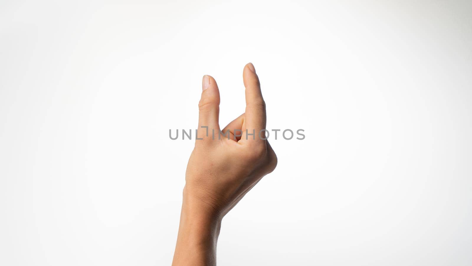 Women's fingers show a small distance on a white background by voktybre