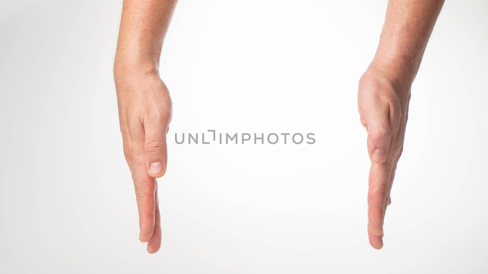 Men's hands put the box on white background. High quality photo