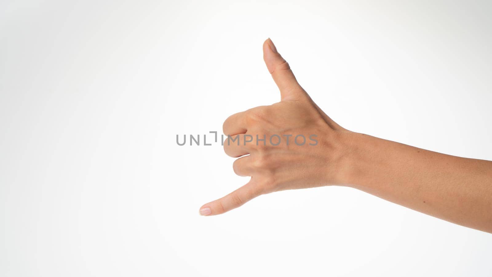 woman's hand gesture greeting surfers shaka thumb and little finger protruded by voktybre