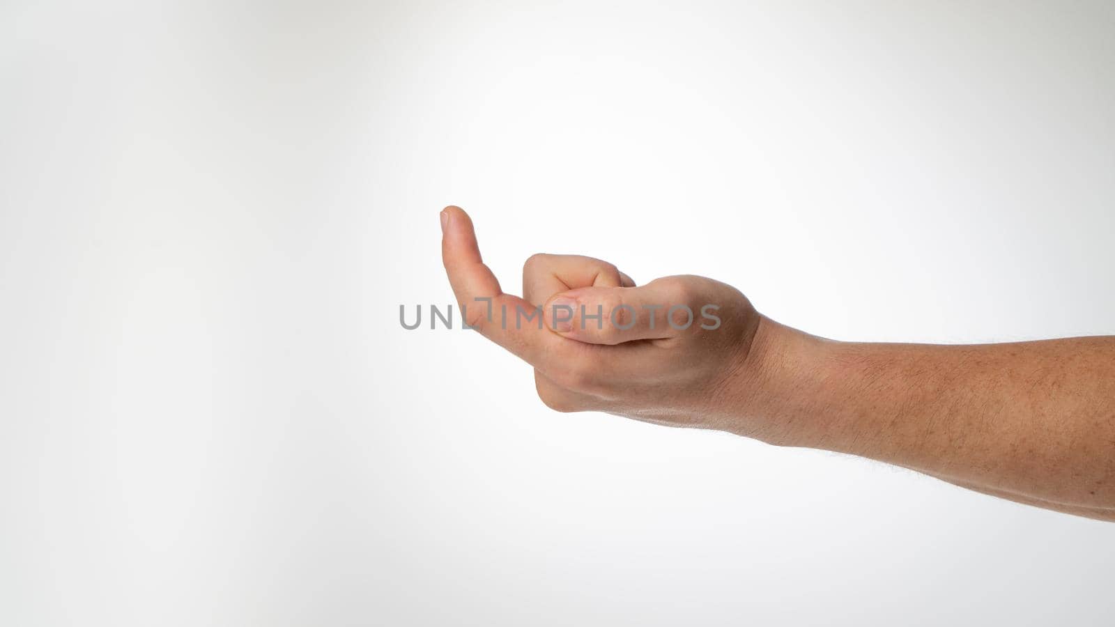 A man's hand gesture to call a finger to himself like a hook. High quality photo