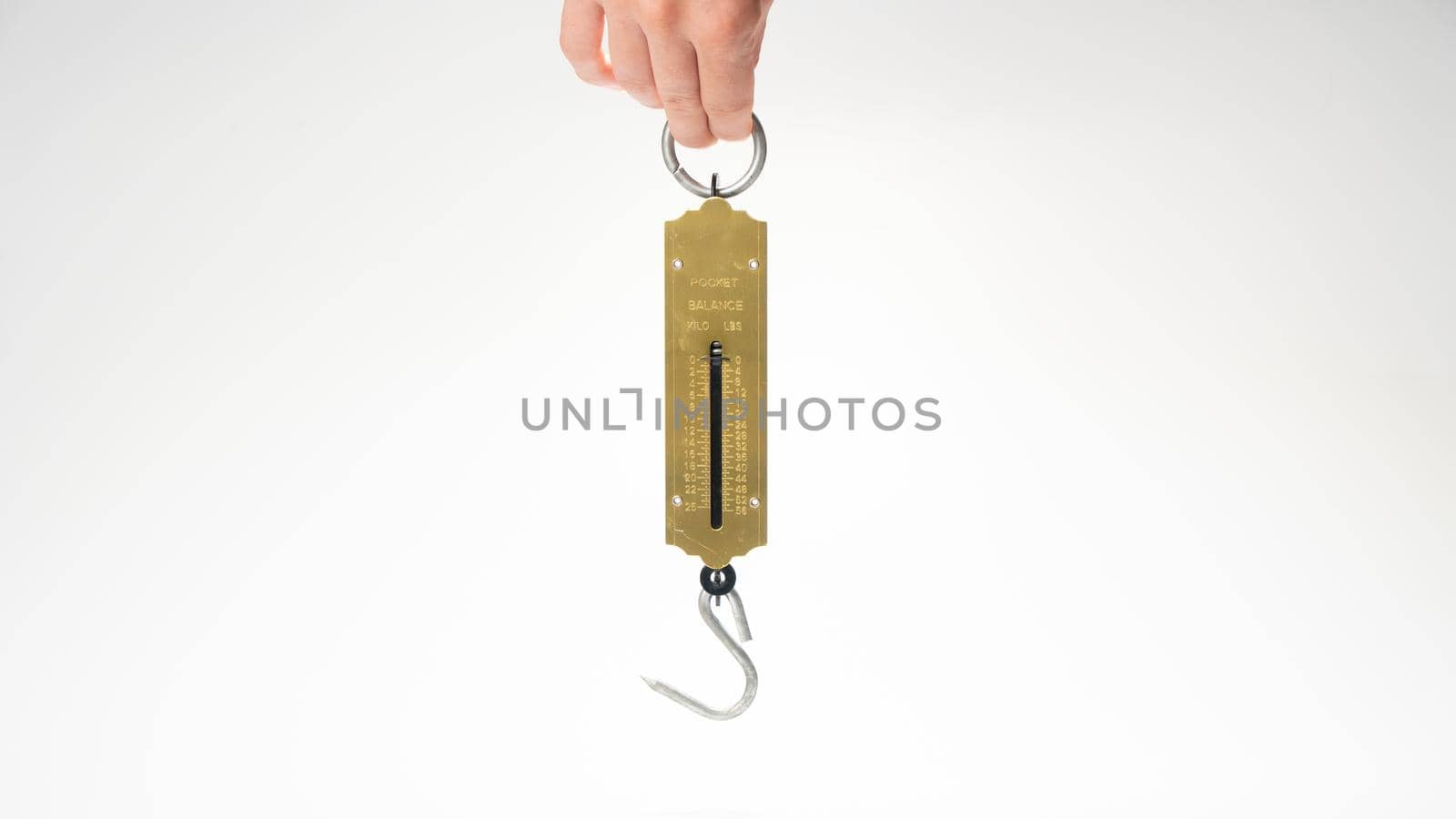 Hand holds a bezmen with a weighing hook. High quality photo