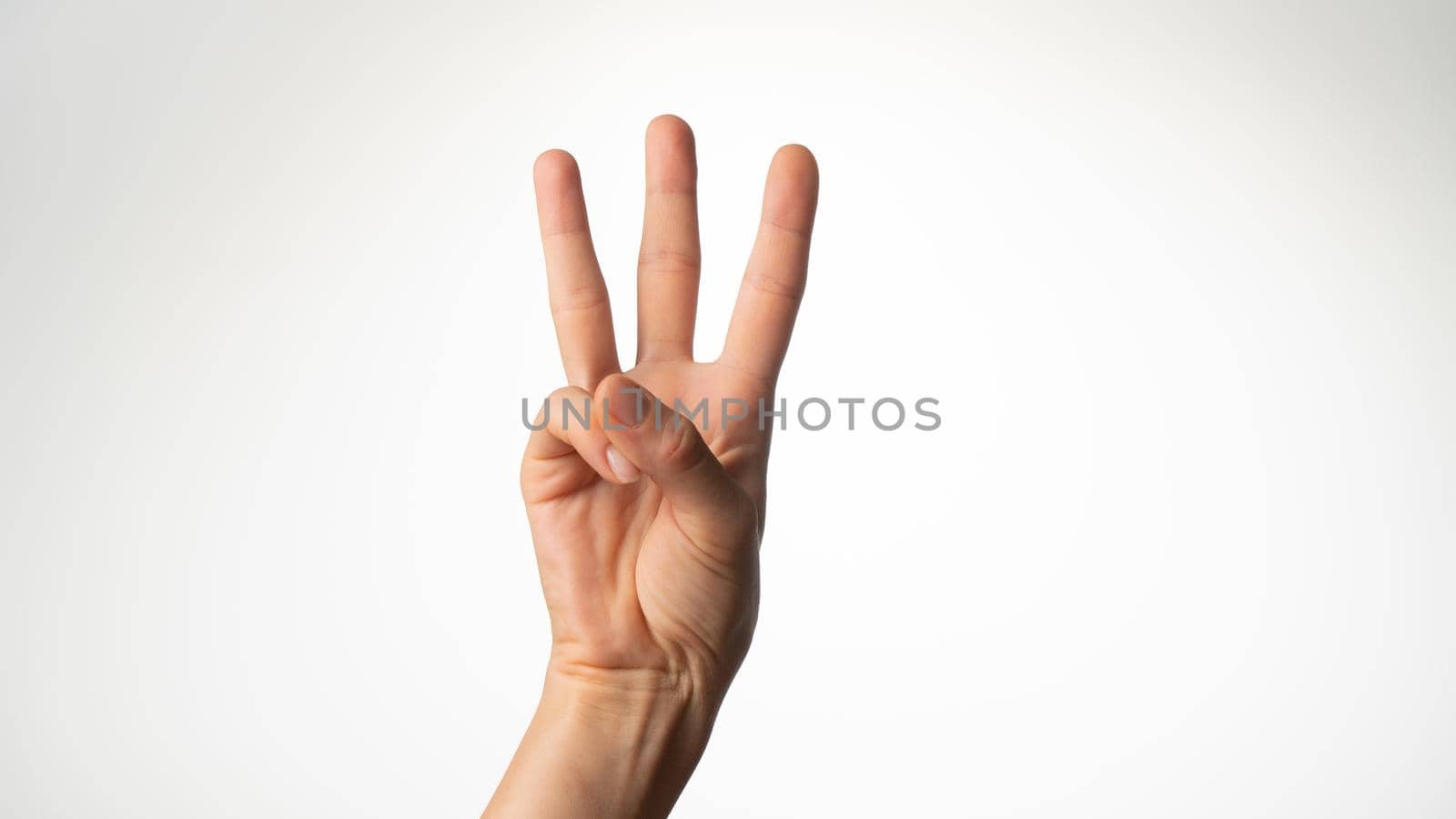 Women's hands gesture counting on fingers three palm side by voktybre