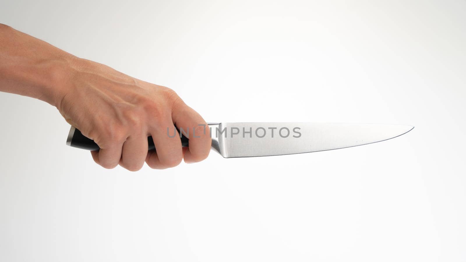 Kitchen knife in the right hand of a woman on a white background by voktybre