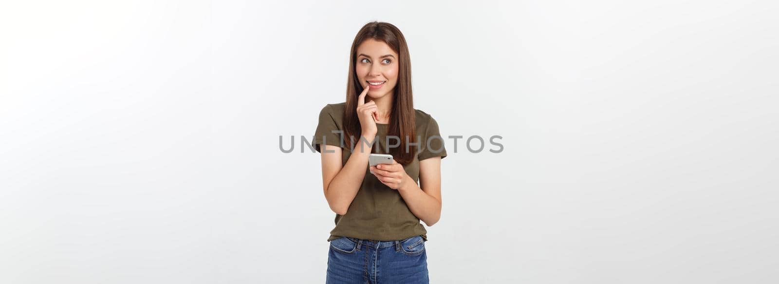 Laughing woman talking and texting on the phone isolated on a white background