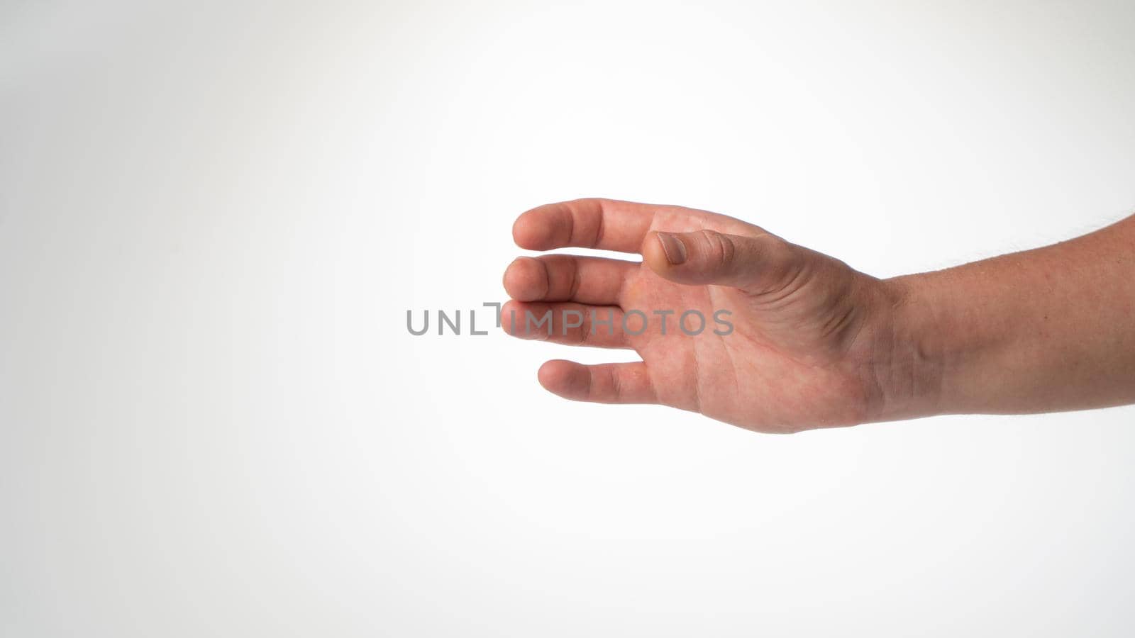 Hand man gesture place under glass bottle cylinder on white background. High quality photo