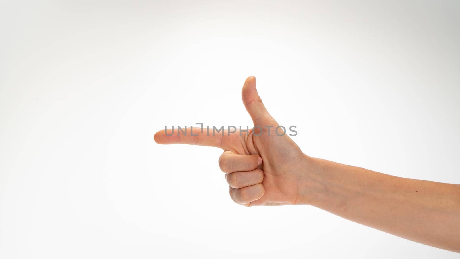 woman's hand gesture folded like a gun insulated on a white background by voktybre