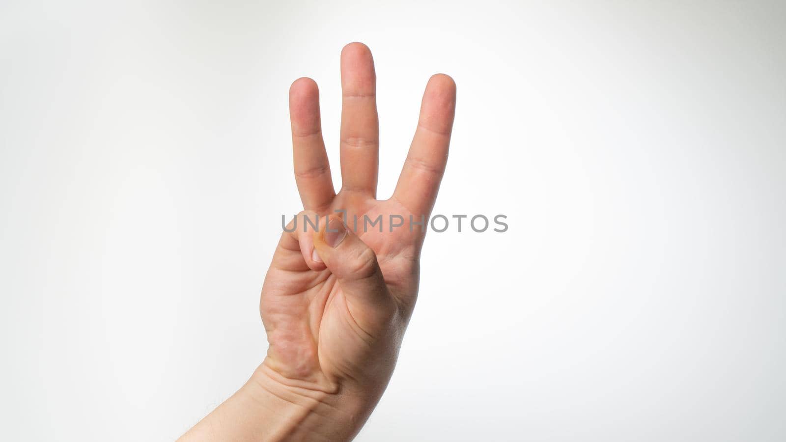 Men's hands gesture counting on fingers three palmar side by voktybre