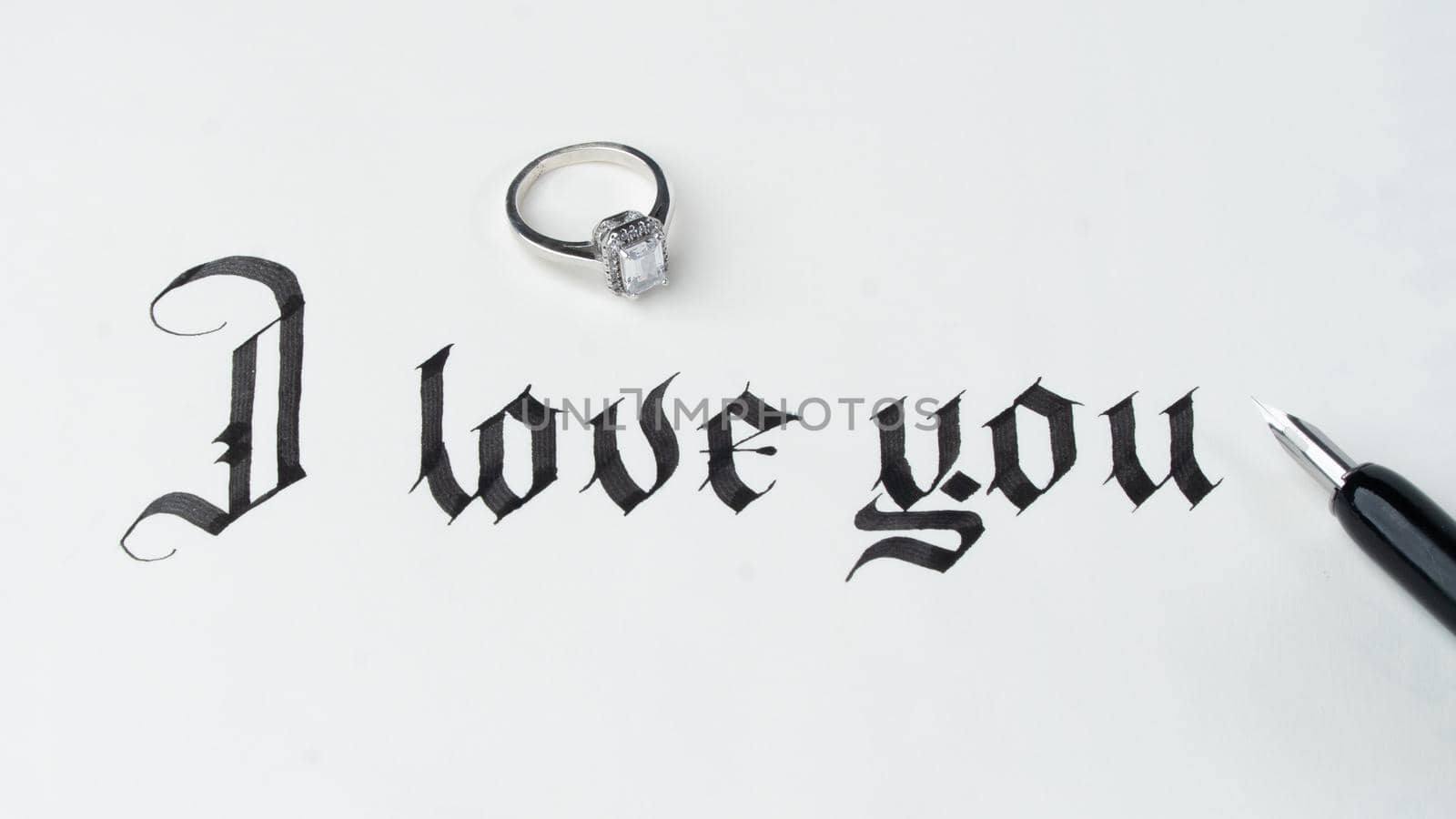 Calligraphy I love you with wedding ring and fountain pen by voktybre