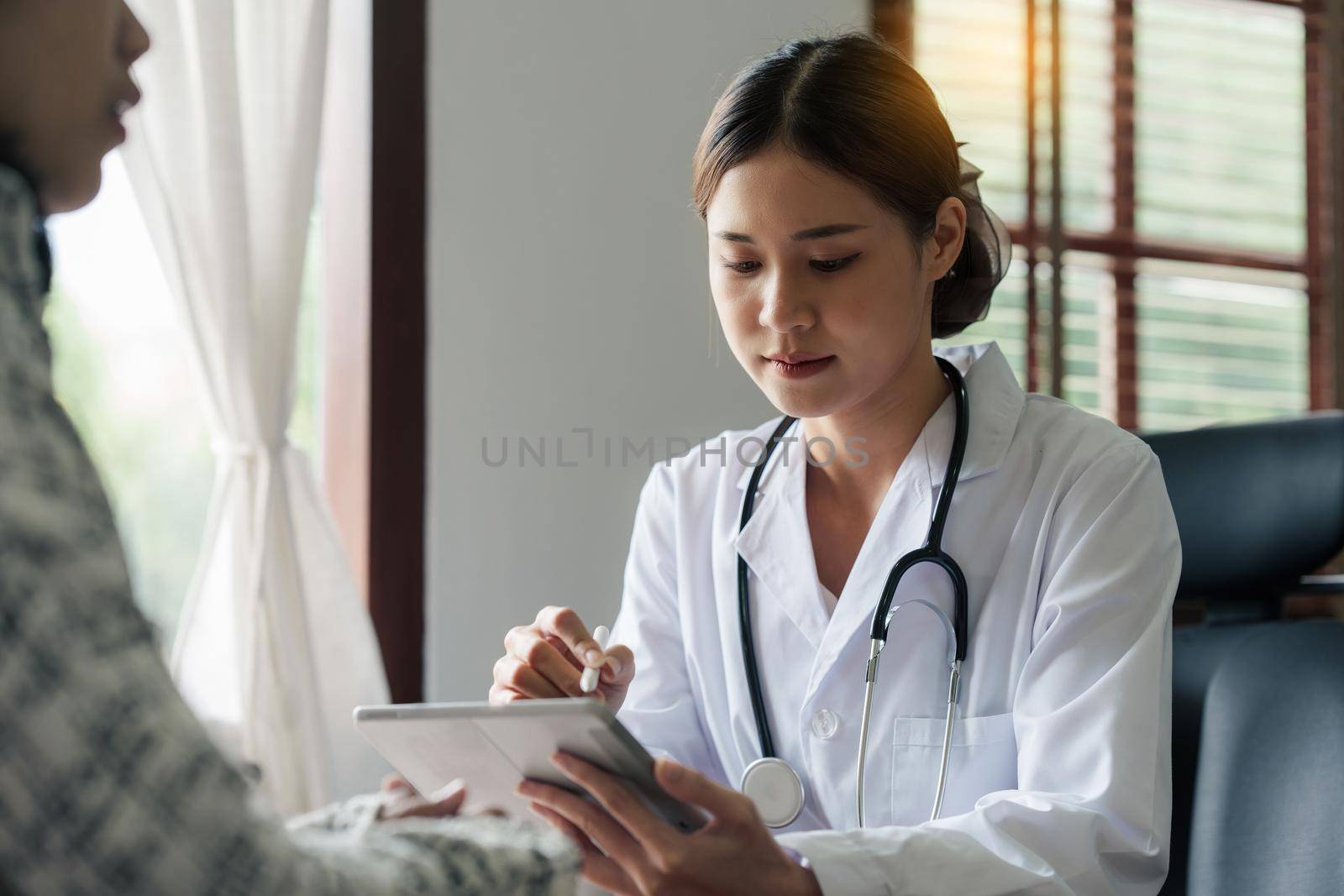 Doctor explain to patient about health care. Medicine and health care and insurance concept.