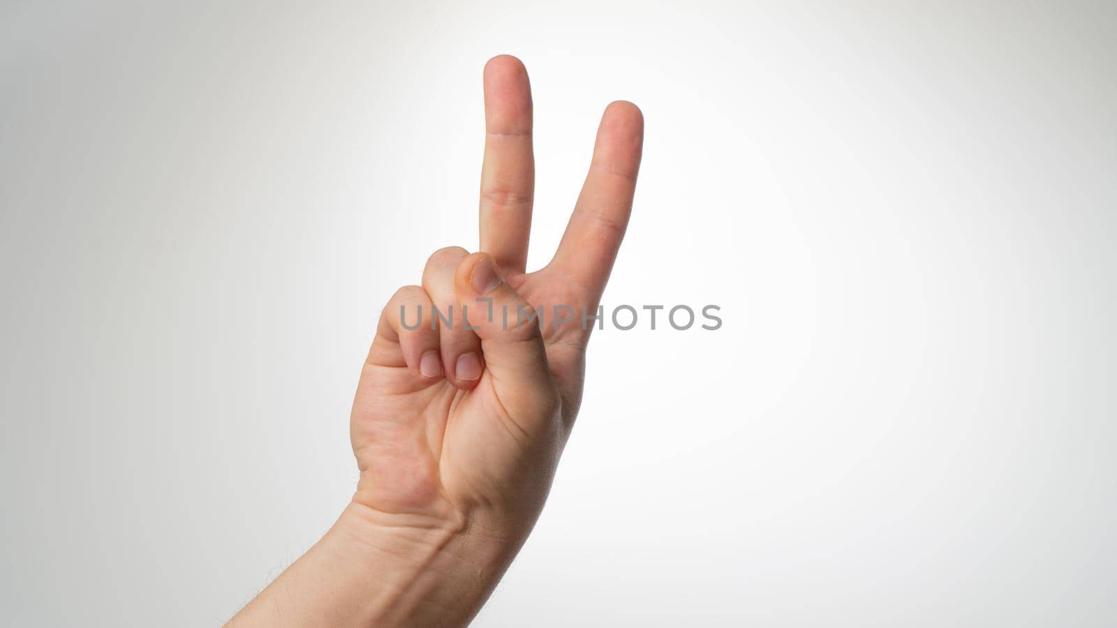 Men's hands gesture counting on fingers 2 palmar side. High quality photo