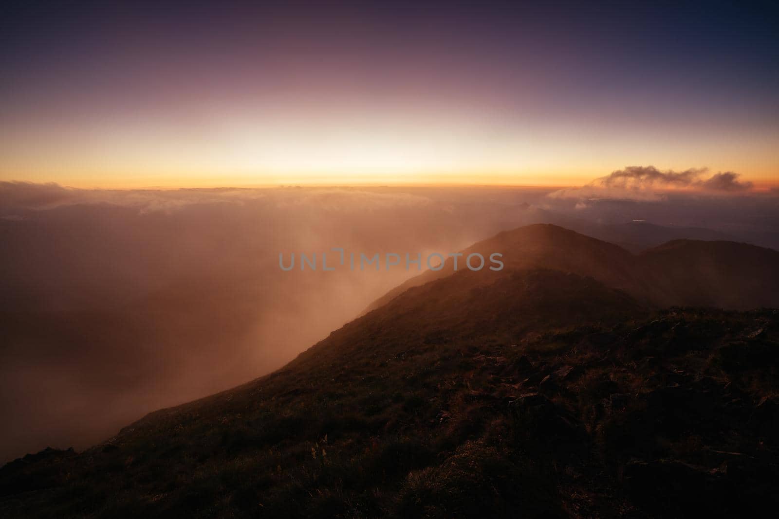 Landscape views of sunset from the summit of Mt Buller over the Victorian Alps in the Victorian High Country, Australia