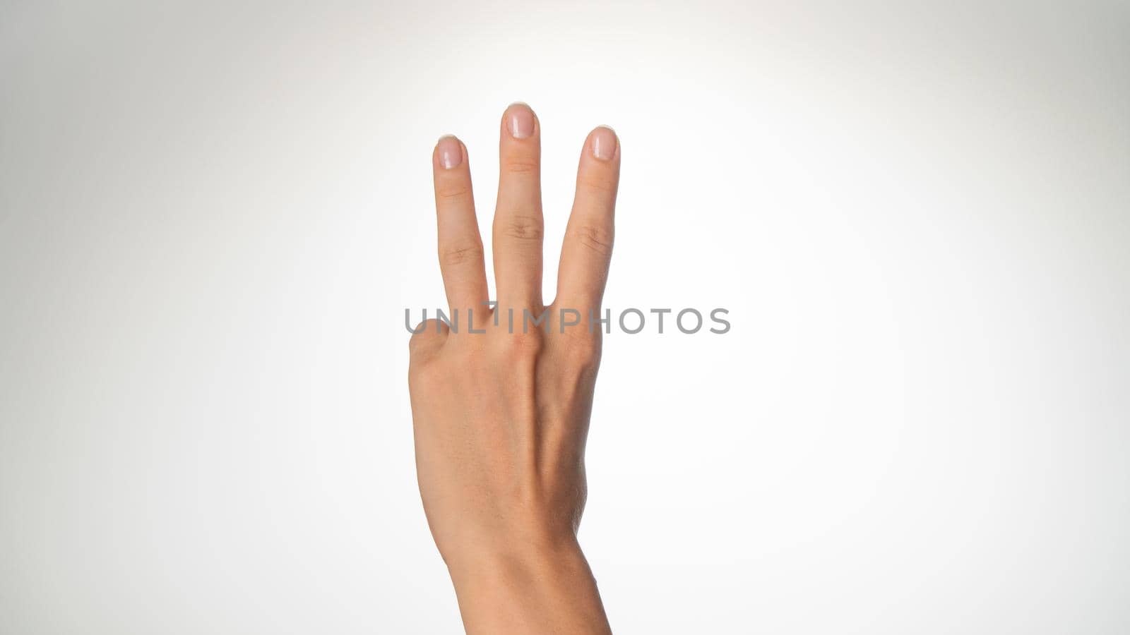 Women's hands count on fingers 3 back of palms. High quality photo