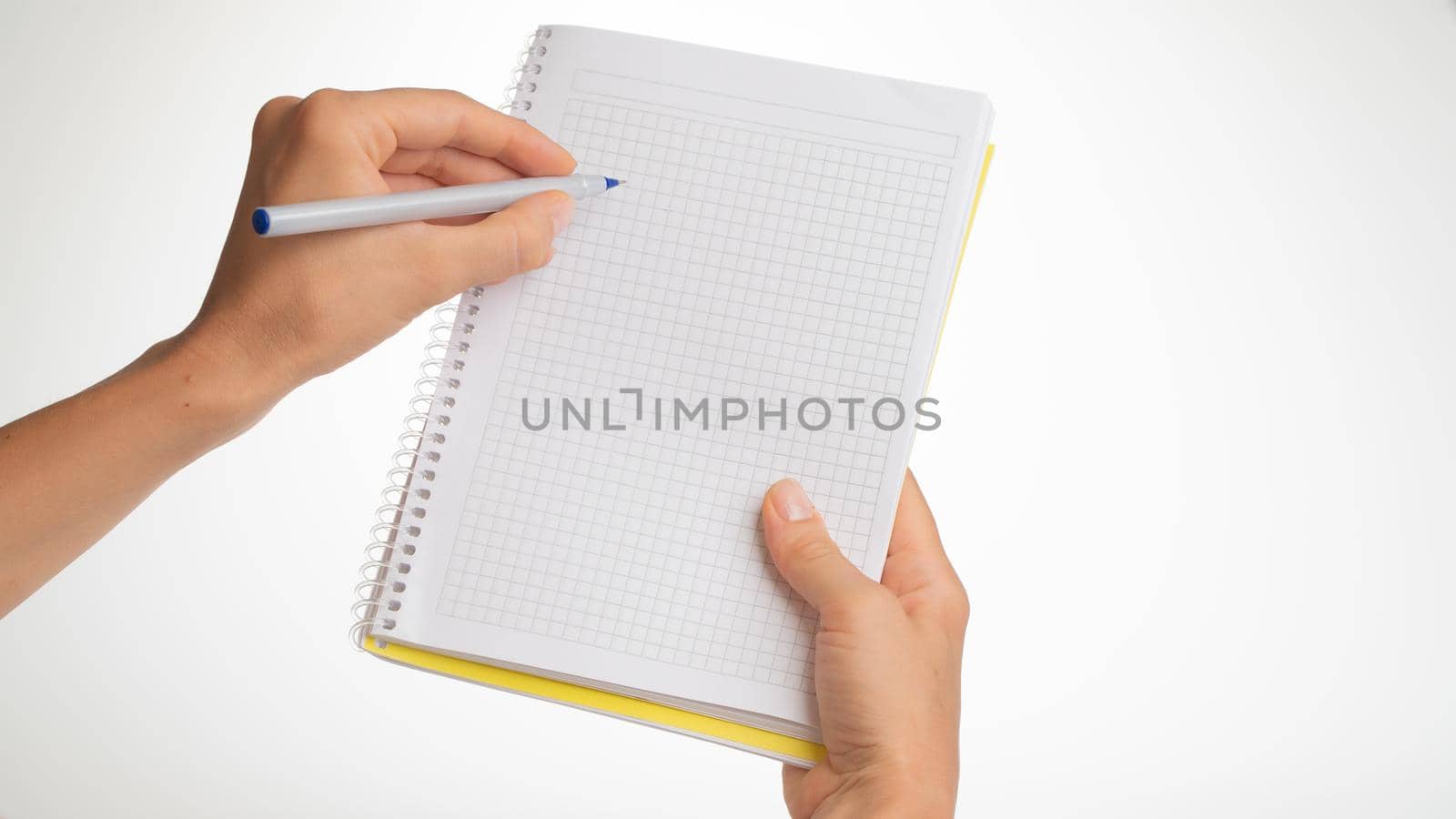 women's hands hold a notebook in a cage left hand with a left-handed pen lefty by voktybre