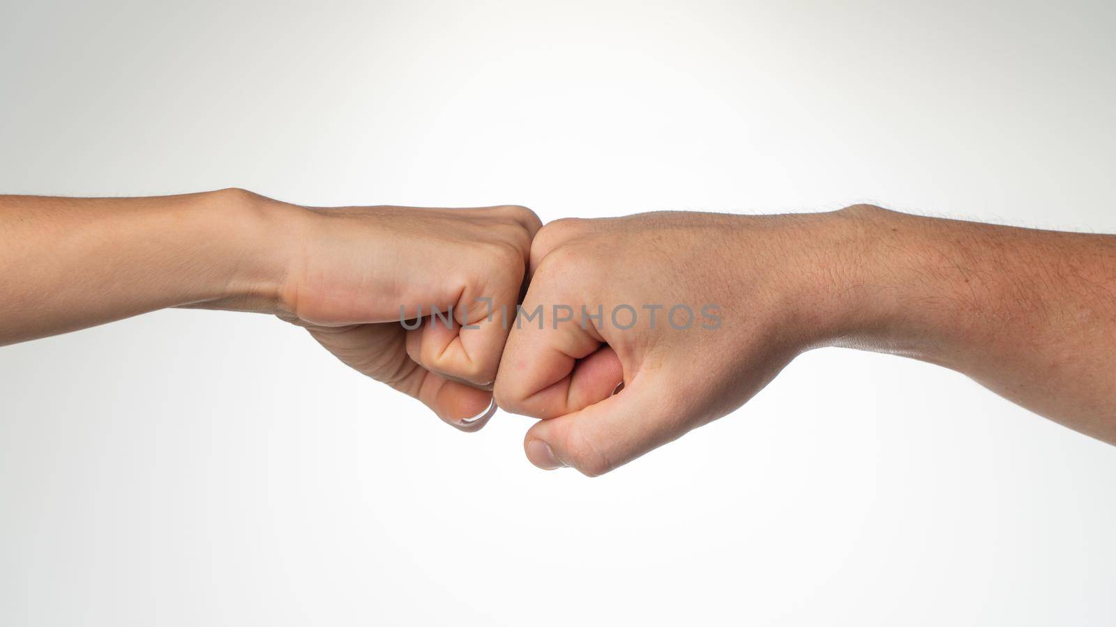 Two fists together gesture greeting friends. High quality photo